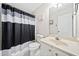 Clean bathroom with shower/tub combo and updated vanity at 902 College Place Nw Ct, Kennesaw, GA 30144