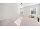 Well-lit bedroom with two windows and plush carpeting at 902 College Place Nw Ct, Kennesaw, GA 30144