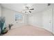 Bright bedroom featuring a ceiling fan and ample closet space at 902 College Place Nw Ct, Kennesaw, GA 30144