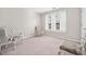 Charming bedroom with two elegant chairs and a window seat at 902 College Place Nw Ct, Kennesaw, GA 30144