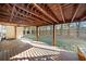 Covered deck with ceiling fan overlooks fenced backyard at 902 College Place Nw Ct, Kennesaw, GA 30144