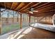 Covered deck with ceiling fan and adjacent patio area at 902 College Place Nw Ct, Kennesaw, GA 30144
