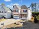 Two-story house with stone accents and a landscaped yard at 902 College Place Nw Ct, Kennesaw, GA 30144