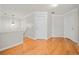 Light-filled hallway with hardwood floors and access to multiple rooms at 902 College Place Nw Ct, Kennesaw, GA 30144