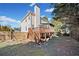 Two-story house with deck, stairs, and fenced backyard at 902 College Place Nw Ct, Kennesaw, GA 30144