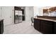 Kitchen boasts stainless steel appliances and dark wood cabinets at 902 College Place Nw Ct, Kennesaw, GA 30144