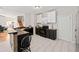 Open concept kitchen with dark and white cabinets and a breakfast bar at 902 College Place Nw Ct, Kennesaw, GA 30144