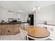 Kitchen features dark cabinets, stainless steel appliances, and breakfast bar at 902 College Place Nw Ct, Kennesaw, GA 30144