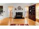 Living room with hardwood floors, fireplace, and seating area at 902 College Place Nw Ct, Kennesaw, GA 30144