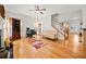 Living room with hardwood floors, fireplace, and home office space at 902 College Place Nw Ct, Kennesaw, GA 30144