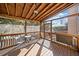 Enjoy the outdoors on this screened porch with wooden deck at 902 College Place Nw Ct, Kennesaw, GA 30144
