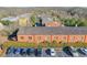 Aerial view of brick townhouses with ample parking at 235 Founders Mill Ct, Roswell, GA 30075