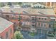 Brick townhomes with private balconies and garages at 235 Founders Mill Ct, Roswell, GA 30075