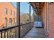 Private balcony with a comfortable swing and views of the courtyard at 235 Founders Mill Ct, Roswell, GA 30075