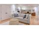 Comfortable basement lounge area with sofa and ottoman at 235 Founders Mill Ct, Roswell, GA 30075