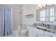 Clean bathroom with shower/tub combo, granite countertop, and updated fixtures at 235 Founders Mill Ct, Roswell, GA 30075
