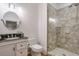 Basement bathroom with walk-in shower and oval mirror at 235 Founders Mill Ct, Roswell, GA 30075