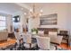 Stylish dining room with hardwood floors, modern decor, and view of the living space at 235 Founders Mill Ct, Roswell, GA 30075