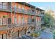Multi-level brick home with balconies, garage parking and partial landscape view at 235 Founders Mill Ct, Roswell, GA 30075