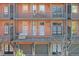 Brick townhome with multiple balconies and garages at 235 Founders Mill Ct, Roswell, GA 30075