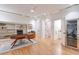 Bright home office with hardwood floors, built-in shelves, and a wine cooler at 235 Founders Mill Ct, Roswell, GA 30075