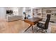 Finished basement home office with built-in shelving and hardwood floors at 235 Founders Mill Ct, Roswell, GA 30075