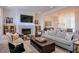 Spacious living room with a modern fireplace, hardwood floors and comfortable seating at 235 Founders Mill Ct, Roswell, GA 30075