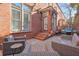 Relaxing patio area with brick pavement and wicker furniture at 235 Founders Mill Ct, Roswell, GA 30075