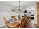 Dining room with wooden table, chairs, and view into living area at 2712 Sam Calvin Dr, Dacula, GA 30019