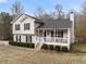 Two-story house with a wrap-around porch and large backyard at 2712 Sam Calvin Dr, Dacula, GA 30019