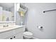 Clean bathroom with white vanity, shower, and toilet at 118 Michael Ct, Dallas, GA 30157