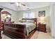 Spacious bedroom with a large sleigh bed and wood furniture at 118 Michael Ct, Dallas, GA 30157