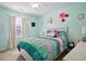 Bedroom with a teal accent wall and polka dot curtains at 118 Michael Ct, Dallas, GA 30157