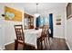 Bright dining room with a wooden table and hardwood floors at 118 Michael Ct, Dallas, GA 30157