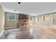 Finished basement with a stone fireplace and concrete floors at 2038 Clairmont Ne Ter, Atlanta, GA 30345