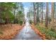 Private gated driveway entrance with tree lined path at 2038 Clairmont Ne Ter, Atlanta, GA 30345