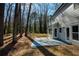 Home exterior with patio overlooking a beautiful wooded backyard and blue painted concrete at 2189 Wood Glen Se Ln, Marietta, GA 30067