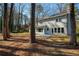 The house has a backyard, a wooden area and a patio painted blue at 2189 Wood Glen Se Ln, Marietta, GA 30067