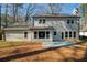 Backyard of home with view of windows and glass doors and blue painted patio at 2189 Wood Glen Se Ln, Marietta, GA 30067