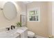 Stylish powder room featuring a vessel sink, modern fixtures, and a large mirror at 2189 Wood Glen Se Ln, Marietta, GA 30067