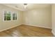 Empty bedroom with a large window, hardwood floors, and neutral paint at 2189 Wood Glen Se Ln, Marietta, GA 30067