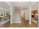 Inviting entryway with hardwood floors, staircase, and views into the living room and kitchen at 2189 Wood Glen Se Ln, Marietta, GA 30067