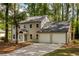 Charming two-story home featuring a well-manicured lawn, and a two car garage at 2189 Wood Glen Se Ln, Marietta, GA 30067