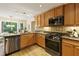 Modern kitchen with stainless appliances, granite counters, and a view to the backyard at 2189 Wood Glen Se Ln, Marietta, GA 30067