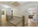 Upstairs hallway features hardwood floors and entryways to bedrooms, and a hall bathroom at 2189 Wood Glen Se Ln, Marietta, GA 30067