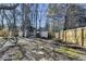 Backyard view with two storage sheds and stepping stones at 4065 Delamar Dr, Cumming, GA 30041