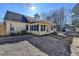 Back exterior view showing a sunroom, hot tub, and fenced backyard at 4065 Delamar Dr, Cumming, GA 30041