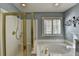 Bathroom with a large garden tub, a separate shower, and updated fixtures at 4065 Delamar Dr, Cumming, GA 30041