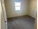 Simple bedroom with carpeted floor and window at 4551 Jackybell Trl, Decatur, GA 30034