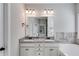 Double vanity bathroom with granite countertop and soaking tub at 728 Harmony Rd, Temple, GA 30179